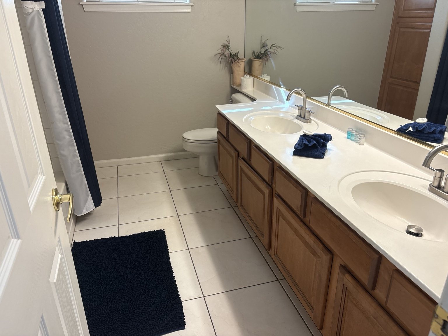 Bathroom with clean counters and neatly arranged towels